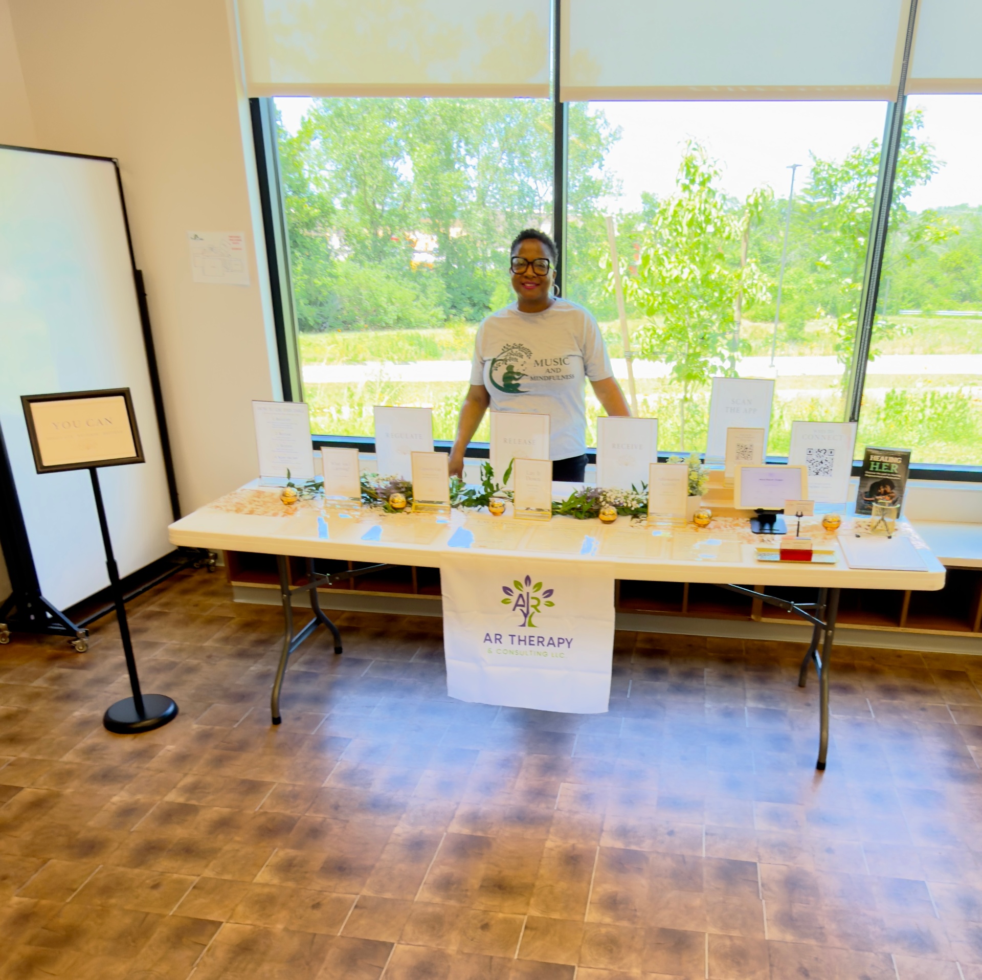 AR Therapy & Consulting welcome table at the Music & Mindfulness Reset Experience