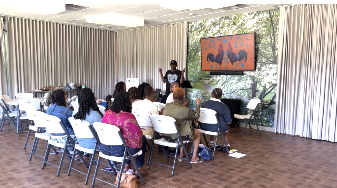 Facilitator leading a reflection at the front of the room
