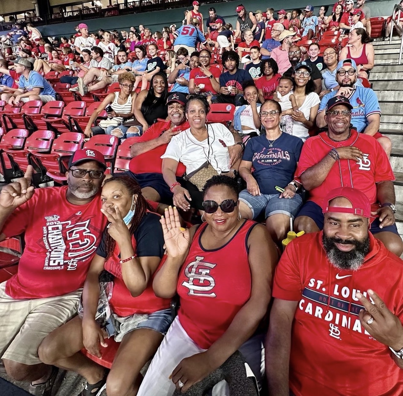 Care Solutions families and teens together in the stands at a St. Louis Cardinals game